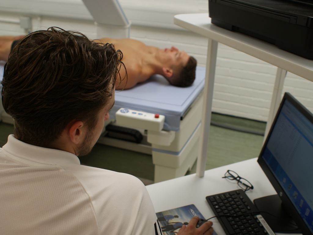 DXA scan performs body composition measurements